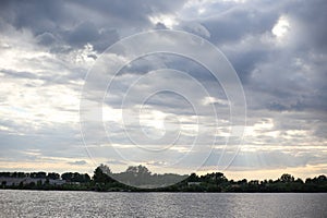 Landscape seascape view of cloudy sky and one lonely boat yach floating in calm river