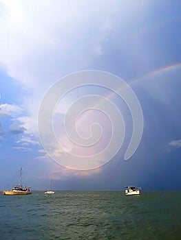 landscape seascapes sea ocean water storm rainbow ship ships