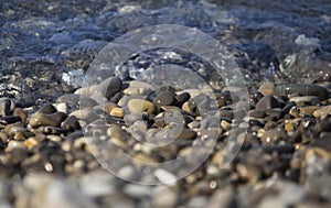 Landscape on the seashore ,pebbles with calm waves