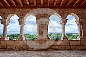 Landscape seen through romanesque church archs