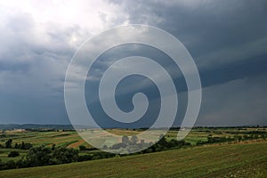 Landscape of Serbia Mountain. Green meadows and hills under blue sky with clouds in springtime