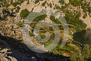 Landscape with a series of small waterfalls on Krupa river in Croatia