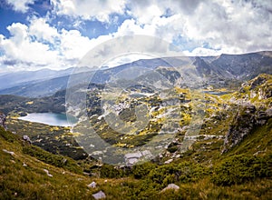 Landscape of the Seven Rila Lakes in Bulgaria.Beautiful nature shot,mountains.Reflecting water on sunny cloudy day.