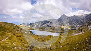 Landscape of the Seven Rila Lakes in Bulgaria.Beautiful nature shot,mountains.Reflecting water on sunny cloudy day.