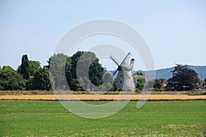 a landscape shot with a historical windmill