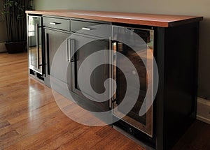 Landscape shot of a wooden furniture piece  in black and brown in the living room