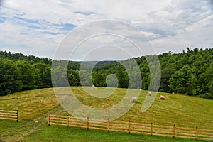 Landscape showing haybales and green summer day