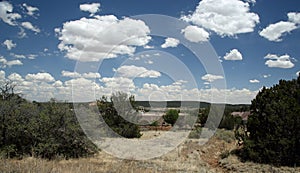 Landscape with shrubs blue sky and cloud with a view of the high desert from Tijeras photo