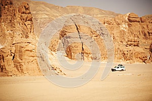 Landscape of Sinai desert with rocks and jeep for safari.