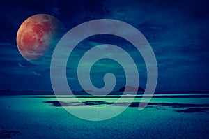 Landscape of sky with bloodmoon on seascape to night. Serenity nature background