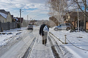 landscape with slippery country road in to Novo-Aleksandrivka village in Dnepropetrovskaya oblast, Ukraine
