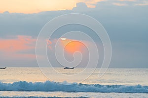Landscape of small fishing boats of Vietnamese fishermen fishing at dawn in the sea