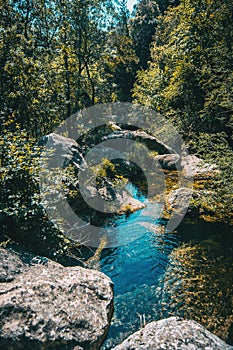 Landscape of a small waterfall in a forest of tarragona, spain