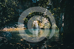 Landscape of a small waterfall in a forest of tarragona, spain