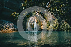 Landscape of a small waterfall in a forest of tarragona, spain