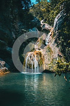 Landscape of a small waterfall in a forest of tarragona, spain