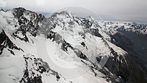 Landscape of snow mountain panorama view from helicopter window in New Zealand.