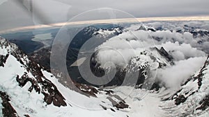 Landscape of snow mountain panorama view from helicopter window in New Zealand.