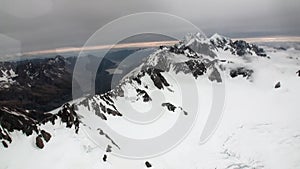 Landscape of snow mountain panorama view from helicopter window in New Zealand.