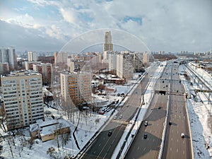 Landscape of the snowy city in winter on a sunny day. Aerial view of the Moscow district of Hovrino