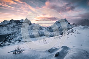 Landscape of Snowy mountain with colorful sky at sunrise