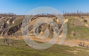 Landscape with soil erosion at early spring season