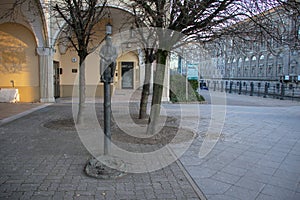 Landscape of a statue of a sitting man in Nikolaiviertel Mitte Berlin Germany