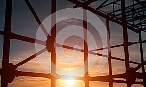 Landscape of steel building frame on background of sunset