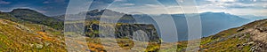 Landscape with steep cliffs in the fjord passing by Trolltunga