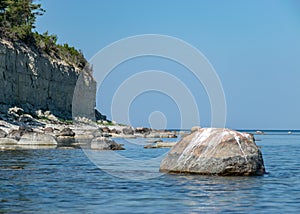Landscape with steep dolomite stone wall, beautiful view of wild romantic coastal cliff landscape at the Baltic Sea at Tagalaht