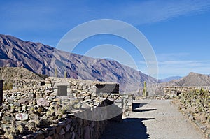 Landscape of a stone house in La Quebrada de Humahuaca photo