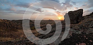 Landscape with stone prairie on sunset