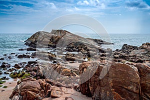 Landscape stones line up the blue sea