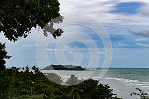 Landscape with storm clouds, sea and tropical island on horizon. Koh Chang, Thailand