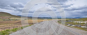 Landscape stormy panorama view from the border of Utah and Idaho from Interstate 84, I-84, view of rural farming with sheep and co