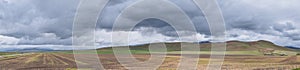 Landscape stormy panorama view from the border of Utah and Idaho from Interstate 84, I-84, view of rural farming with sheep and co