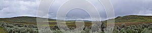 Landscape stormy panorama view from the border of Utah and Idaho from Interstate 84, I-84, view of rural farming with sheep and co