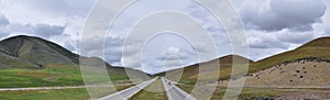 Landscape stormy panorama view from the border of Utah and Idaho from Interstate 84, I-84, view of rural farming with sheep and co