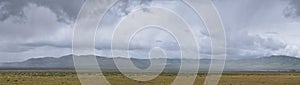 Landscape stormy panorama view from the border of Utah and Idaho from Interstate 84, I-84, view of rural farming with sheep and co