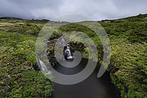 Landscape with stream and small waterfalls on the top of PoÃÂ§o Ribeira do Ferreiro at FajÃÂ£ Grande and FajÃÂ£zinha photo