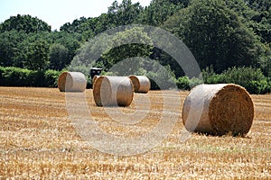 Landscape with a stubble field with straw bales