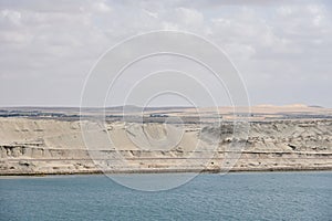 Landscape of Suez Canal, view from transiting cargo ship.