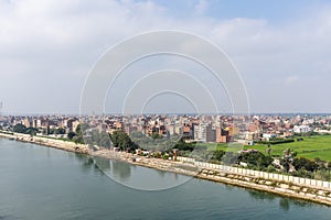 Landscape of the Suez Canal, view from the transiting cargo ship.