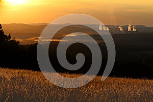 Landscape during sun set with power plant