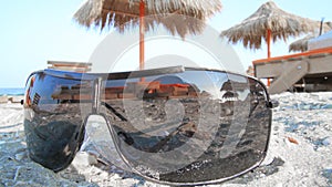 Landscape of sunglasses in the sand