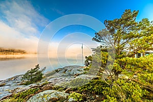 Landscape at sunrise at Kalvofjord as seen from truck parking lot at UddevallavÃ¤gen