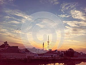 Landscape Of Sunset Behind Network Signal Tower.