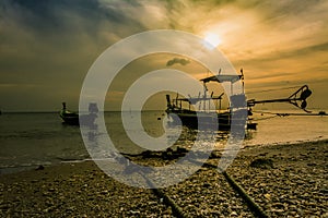 Landscape of sunset with Small Fishing Boats in Thailand