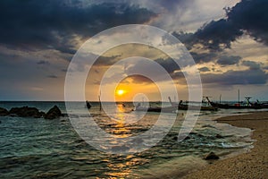 Landscape of sunset with Small Fishing Boats in Thailand