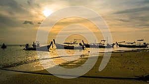 Landscape of sunset with Small Fishing Boats in Thailand